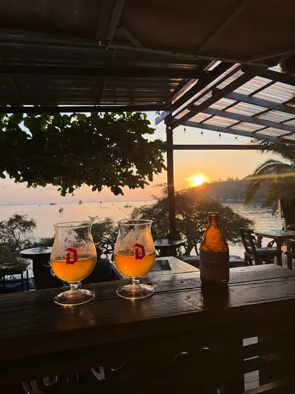 Two Duvel glasses at sunset