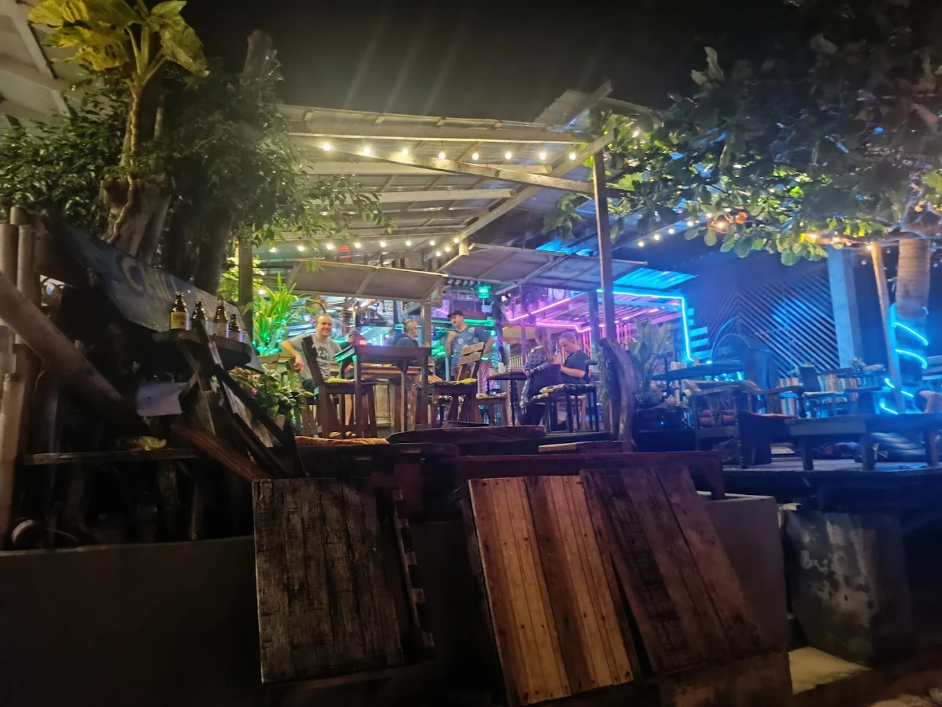 Bar terrace at night with string lights